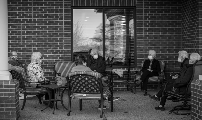 Residents at VMRC sit together to catch up and watch the goings on of the campus.